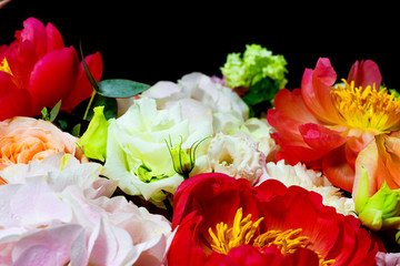 bright white flower arrangement in a basket on a dark background