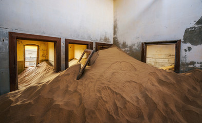 Ruins of a house filled with sand in the mining town Kolmanskop, Namibia