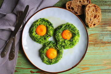 Fried egg in zucchini noodle nest, healthy breakfast, top view