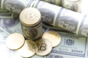 Golden Bitcoin on US dollars banknote background, Exchange Digital currency concept.