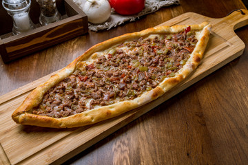 Turkish pide with meat on the board