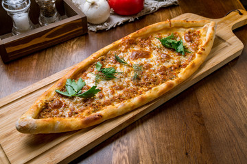 Turkish pide with minced meat and cheese