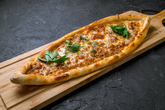 Turkish pide with minced meat and cheese