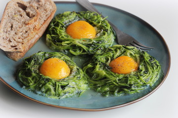 Fried egg in zucchini noodle nest, healthy breakfast, top view