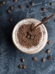 Coffee smoothie with chocolate and milk on a concrete table close-up
