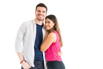 Fototapeta premium Portrait of a cute Latin couple in a studio