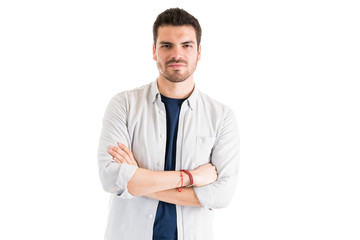 Young Man With Arms Crossed In Studio