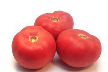 Red ripe tomatoes isolated on white background