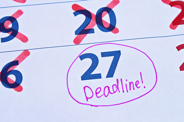 Procrastination Putting things off until later. Calendar deadline crossed out days.