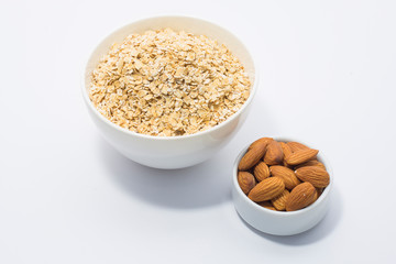 Healthy breakfast ingredients glass of milk, Almond nut and oats