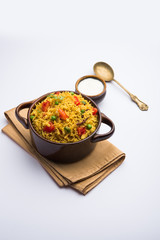 Tomato Rice also known as Tamatar Pilaf/pulav made using basmati rice, served in a bowl. selective focus