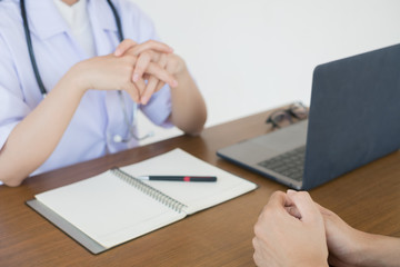 Doctor physician consulting with male patients in hospital exam room. Men's health concept