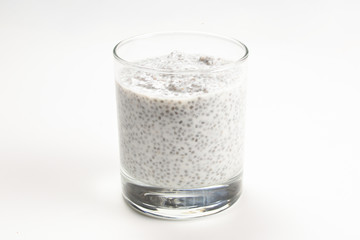 Chia pudding  in glass on a white background. Space for text or design.