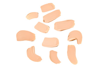 Liquid foundation swatch isolated on white background. Close Up of makeup cream sample.