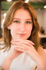 Girl is waiting for a meeting in cafe