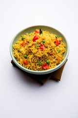 Tomato Rice also known as Tamatar Pilaf/pulav made using basmati rice, served in a bowl. selective focus
