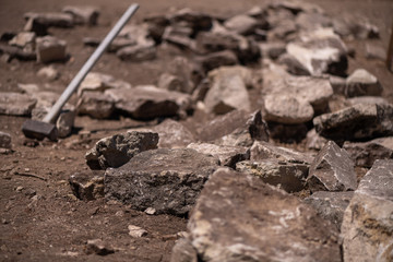 A very big hammer used to break stone for constrtuction