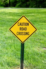 A close view of the yellow caution warning sign.