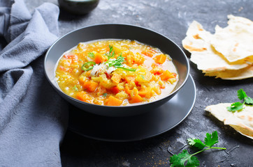Rice and Pumpkin Indian Soup on Dark Background