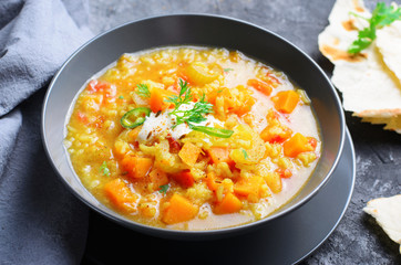 Rice and Pumpkin Indian Soup on Dark Background
