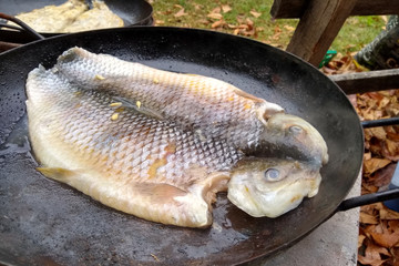 Boga fish steak booked in a wok pan