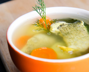 Fish soup served on the table in plate