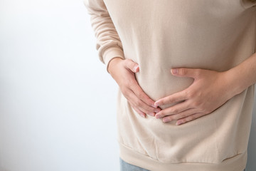 Men with abdominal pain standing, holding the body and hands Photos, concepts of health and medical care