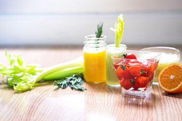 Infused detox water, celery, orange and tomatoes, spun for healthy