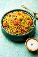 Tomato pulav/Pilaf made using basmati rice, served in a bowl. selective focus