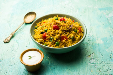 Tomato  pulav/Pilaf made using basmati rice, served in a bowl. selective focus