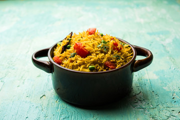 Tomato  pulav/Pilaf made using basmati rice, served in a bowl. selective focus