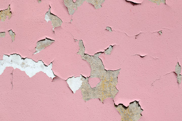 Pink cracked paint on the wall