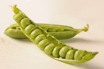 fresh green peas on white background