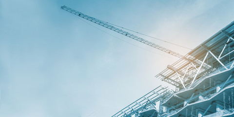 Construction site, cranes and scaffolding , concrete structure