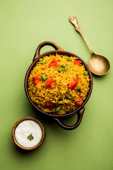 Tomato  pulav/Pilaf made using basmati rice, served in a bowl. selective focus