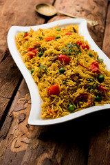 Tomato  pulav/Pilaf made using basmati rice, served in a bowl. selective focus
