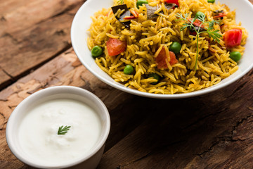 Tomato  pulav/Pilaf made using basmati rice, served in a bowl. selective focus