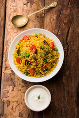 Tomato  pulav/Pilaf made using basmati rice, served in a bowl. selective focus