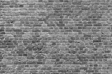 Poster Mur monochrome textured surface of a brick wall