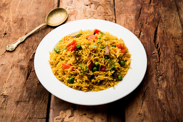 Tomato  pulav/Pilaf made using basmati rice, served in a bowl. selective focus