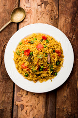 Tomato  pulav/Pilaf made using basmati rice, served in a bowl. selective focus