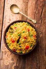 Tomato  pulav/Pilaf made using basmati rice, served in a bowl. selective focus
