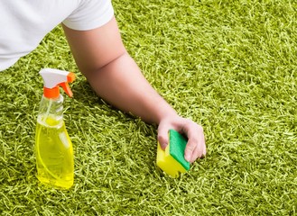 Young husband man cleaning floor at home
