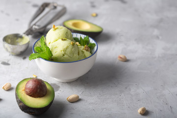 Homemade organic avocado and mint ice cream in a bowl with copy space