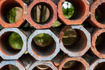 wall of fragments of a clay pipe wall-mounted closeup texture background
