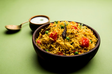 Tomato  pulav/Pilaf made using basmati rice, served in a bowl. selective focus