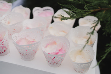 Coziness and style. Modern event design. Lounge zone and european traditional wedding ceremony decoration outdoors in the restaurant before the reception.