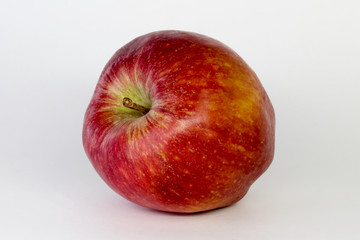 red Apple on a white background, close-up