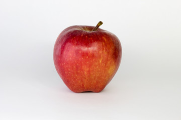 red Apple on a white background, close-up