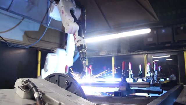 Metal And Iron Welding Robot In The Steel Plant. Rotation